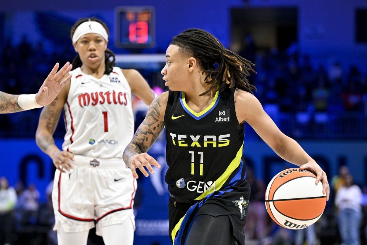 Jun 28, 2025; Arlington, Texas, USA; Dallas Wings guard JJ Quinerly (11) brings the ball up court against the Washington Mystics during the second half at College Park Center. Mandatory Credit: Jerome Miron-Imagn Images