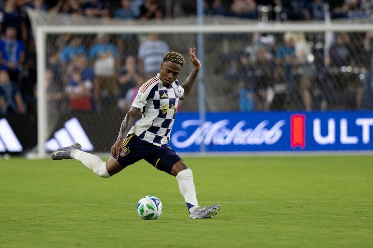 Jun 28, 2025; Kansas City, Kansas, USA; Real Salt Lake midfielder Nelson Palacio (13) kicks the ball during the second half of the match against Sporting Kansas City at Children's Mercy Park. Mandatory Credit: Kylie Graham-Imagn Images