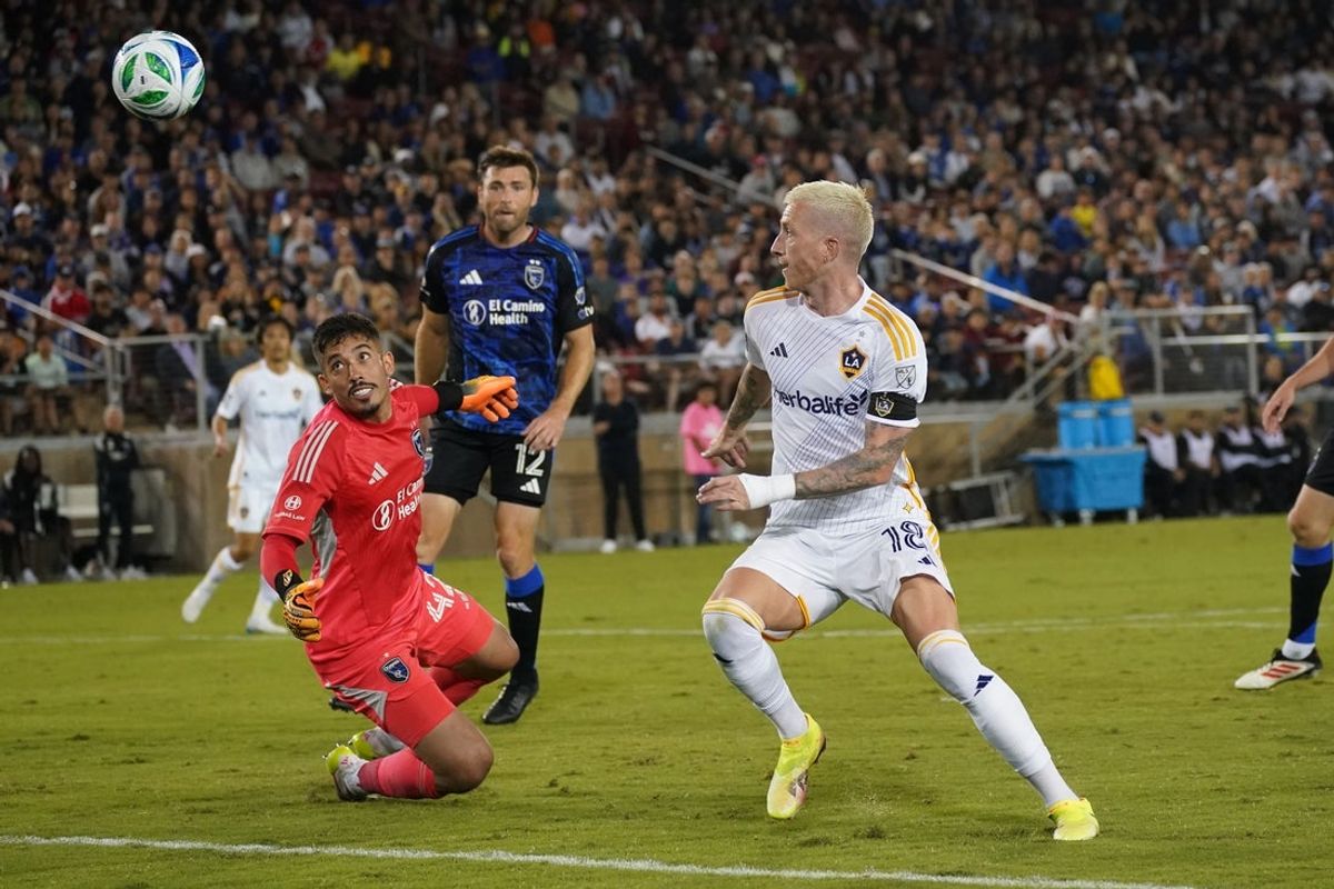 Jun 28, 2025; Stanford, California, USA;  Los Angeles Galaxy midfielder Marco Reus (18) chases his shot deflection by San Jose Earthquakes goalkeeper Daniel (42) in the second half at Stanford Stadium. Mandatory Credit: David Gonzales-Imagn Images