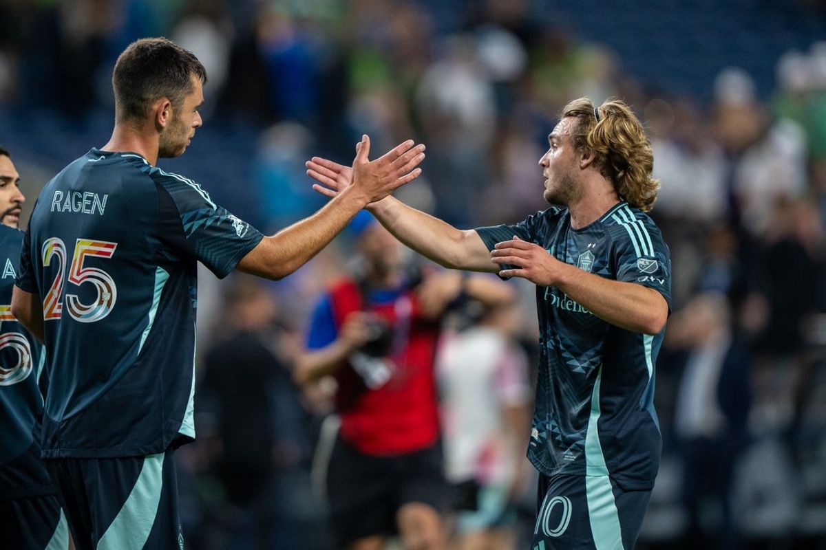 Jun 28, 2025; Seattle, Washington, USA;  Seattle Sounders forward Pedro de la Vega (10) and defender Jackson Ragen (25) celebrate after a game against Austin FC at Lumen Field. Mandatory Credit: Stephen Brashear-Imagn Images