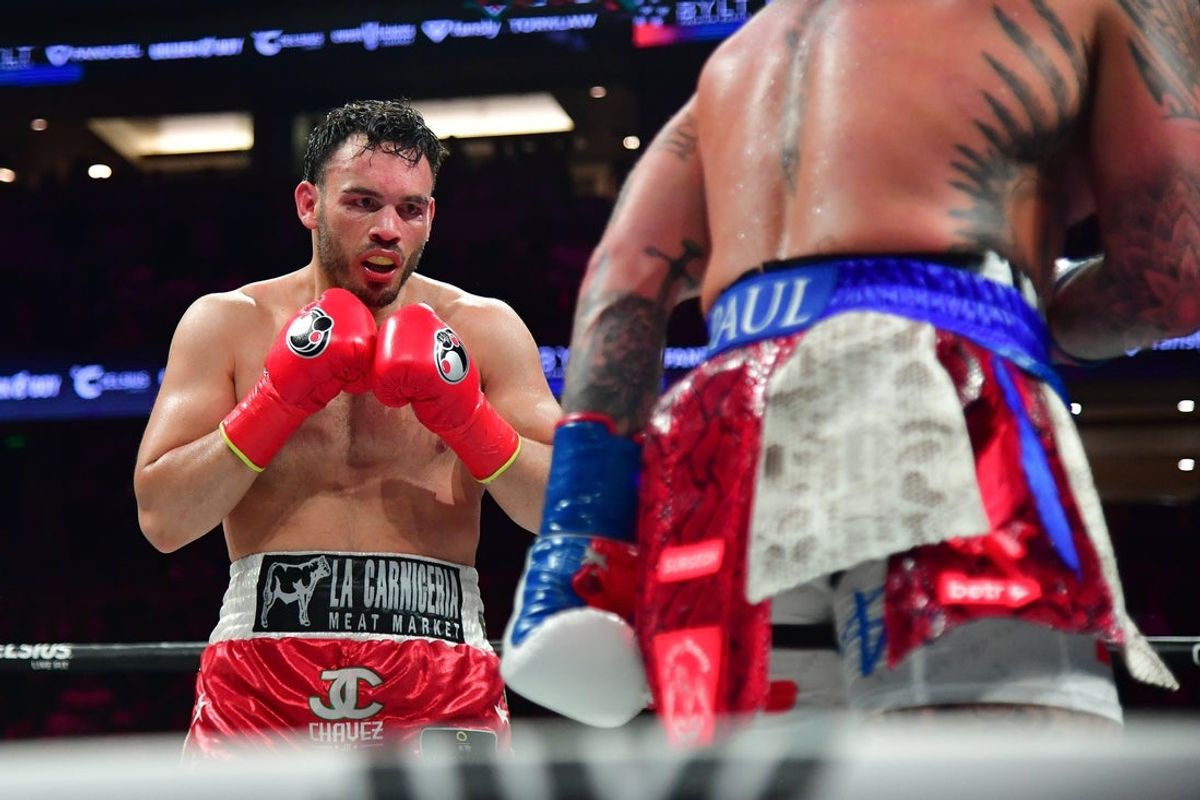 Jun 28, 2025; Anaheim, California, USA; Julio Cesar Chavez Jr. fights against Jake Paul  at Honda Center. Mandatory Credit: Gary A. Vasquez-Imagn Images