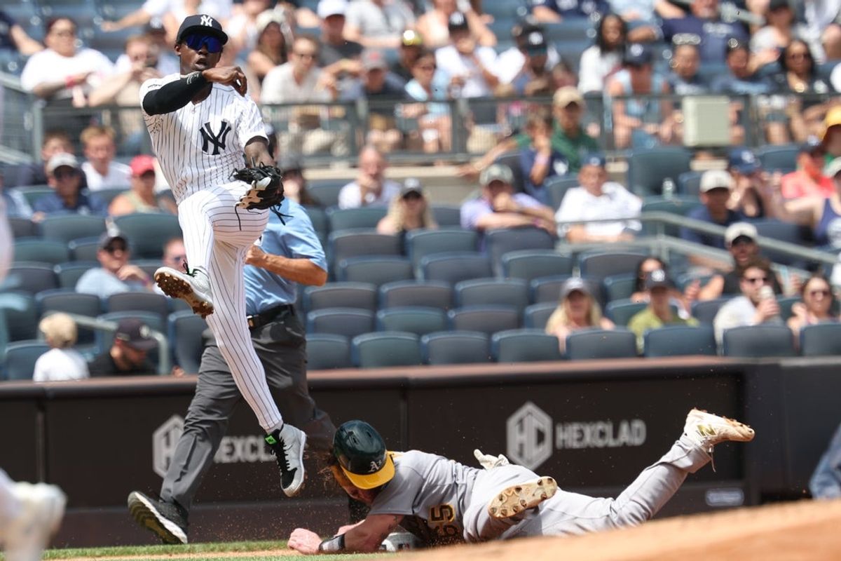 New York Yankees All-Star Jazz Chisholm Jr. (13) forces out Athletics catcher Willie MacIver (65) at third base and throws to first to complete the double play on a ball hit by shortstop Jacob Wilson (5) (not pictured) at Yankee Stadium. Mandatory Credit: Vincent Carchietta-Imagn Images