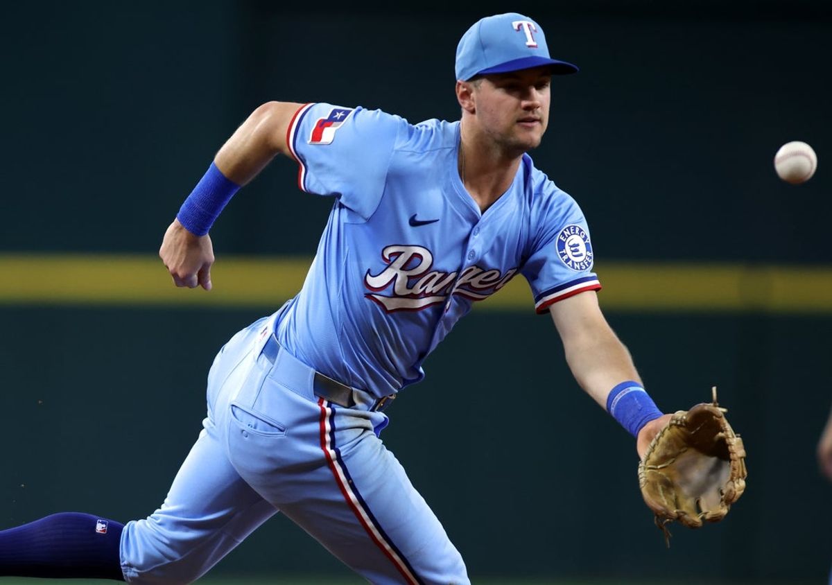 Jun 29, 2025; Arlington, Texas, USA; Texas Rangers third base Josh Jung (6) commits a fielding error during the fourth inning against the Seattle Mariners at Globe Life Field. Mandatory Credit: Tim Heitman-Imagn Images