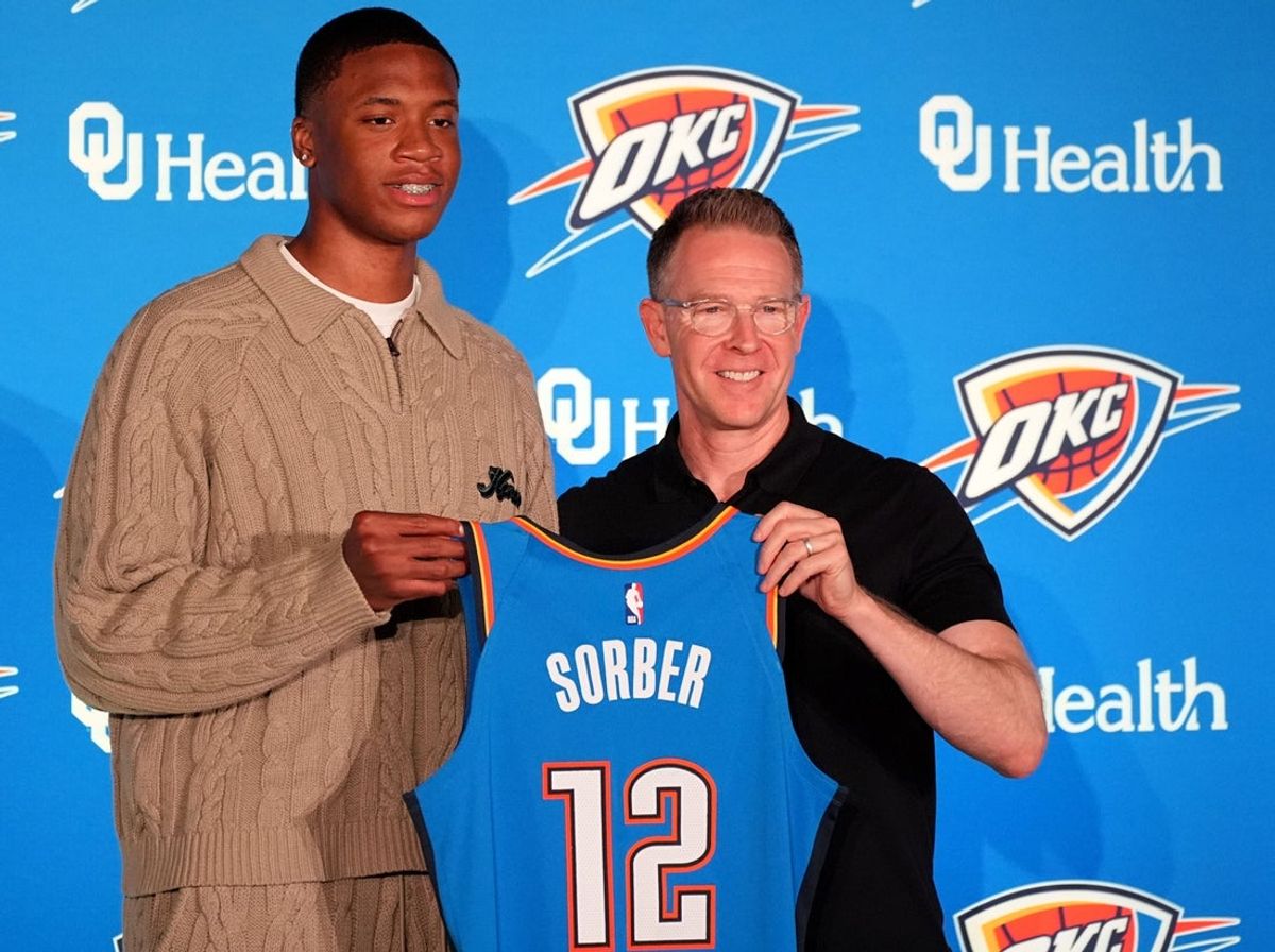 Thunder draft pick Thomas Sorber poses for a photo with general manager Sam Presti during a press conference at the First American's Museum in Oklahoma City, Saturday, June 28, 2025.