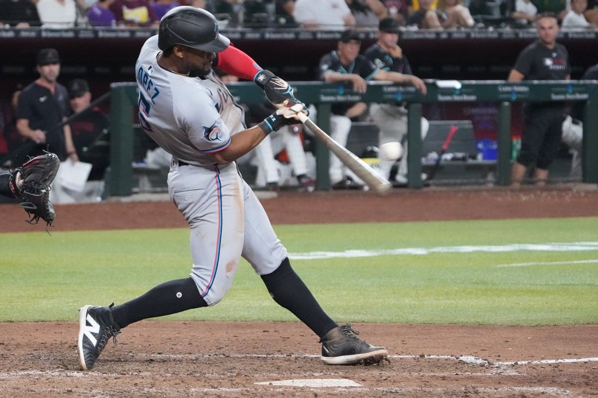 Jun 29, 2025; Phoenix, Arizona, USA; Miami Marlins second base Otto Lopez (6) hits a two RBI single against the Arizona Diamondbacks during the eighth inning at Chase Field. Mandatory Credit: Joe Camporeale-Imagn Images