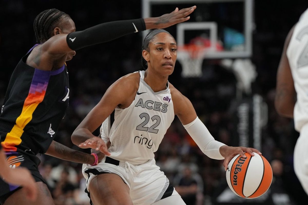 Jun 29, 2025; Phoenix, Arizona, USA; Las Vegas Aces center A'ja Wilson (22) drives against the Phoenix Mercury in the first half at Footprint Center. Mandatory Credit: Rick Scuteri-Imagn Images