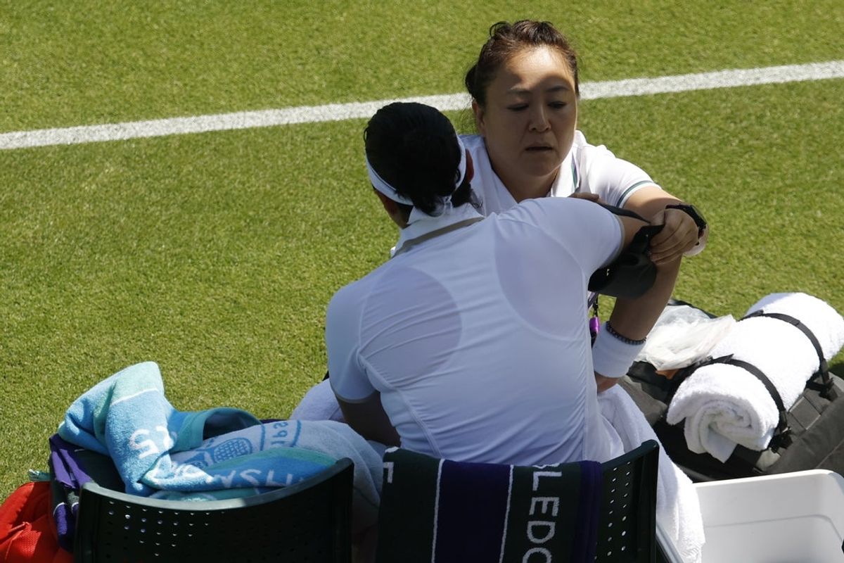 Jun 30, 2025; Wimbledon, United Kingdom; Ons Jabeur (TUN) receives treatment from a WTA trainer during a medical timeout against Viktoriya Tomova (BUL)(not pictured) on day one of The Championships, Wimbledon 2025 at All England Lawn Tennis and Croquet Club. Mandatory Credit: Geoff Burke-Imagn Images