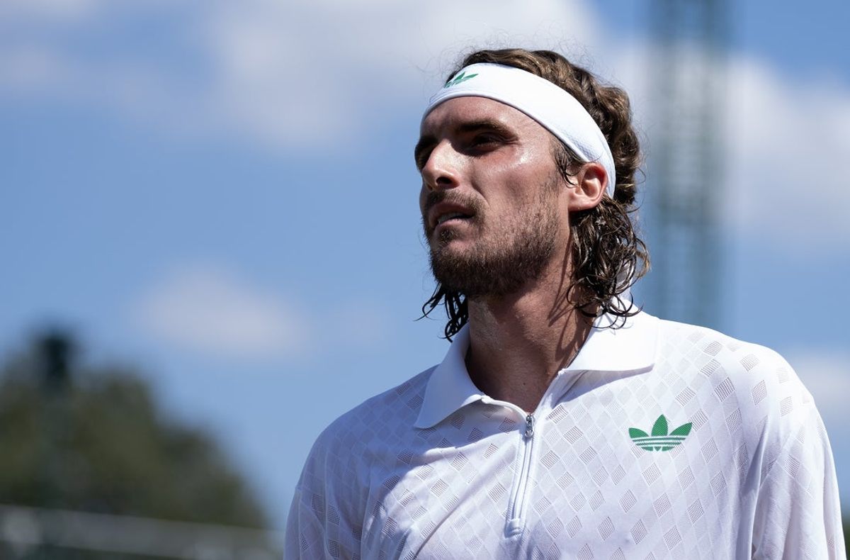 Jun 30, 2025; Wimbledon, UNITED KINGDOM; Stefanos Tsitsipas of Greece during his match against Valentin Royer of France on day one at the All England Lawn Tennis and Croquet Club. Mandatory Credit: Susan Mullane-Imagn Images