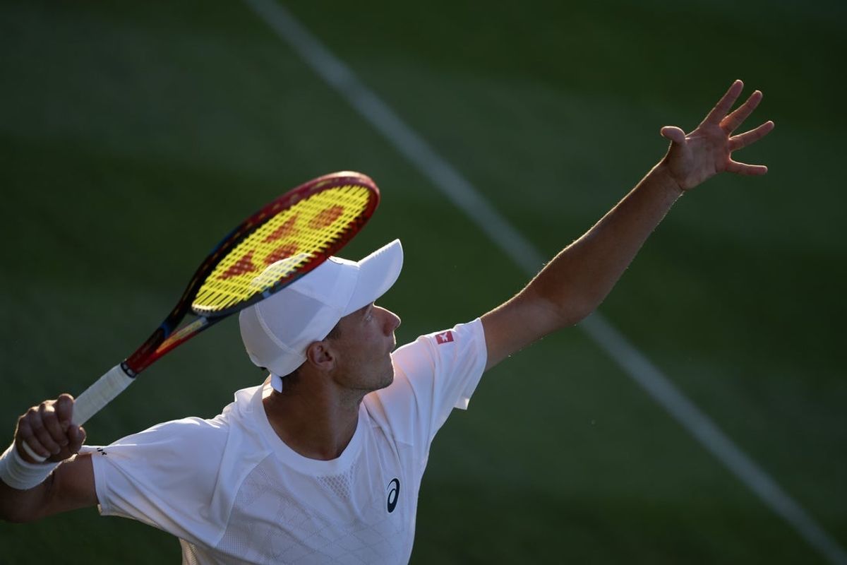 Jun 30, 2025; Wimbledon, UNITED KINGDOM; Kamil Majchrzak of Poland serves during his match against Matteo Berrettini of Italy on day one at the All England Lawn Tennis and Croquet Club. Mandatory Credit: Susan Mullane-Imagn Images