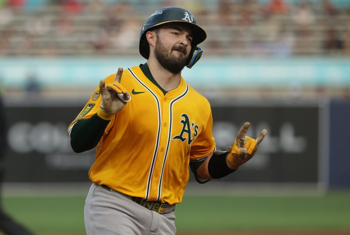 Jun 30, 2025; Tampa, Florida, USA;  Athletics catcher Shea Langeliers (23) hits a three-run home run against the Tampa Bay Rays during the first inning at George M. Steinbrenner Field. Mandatory Credit: Kim Klement Neitzel-Imagn Images