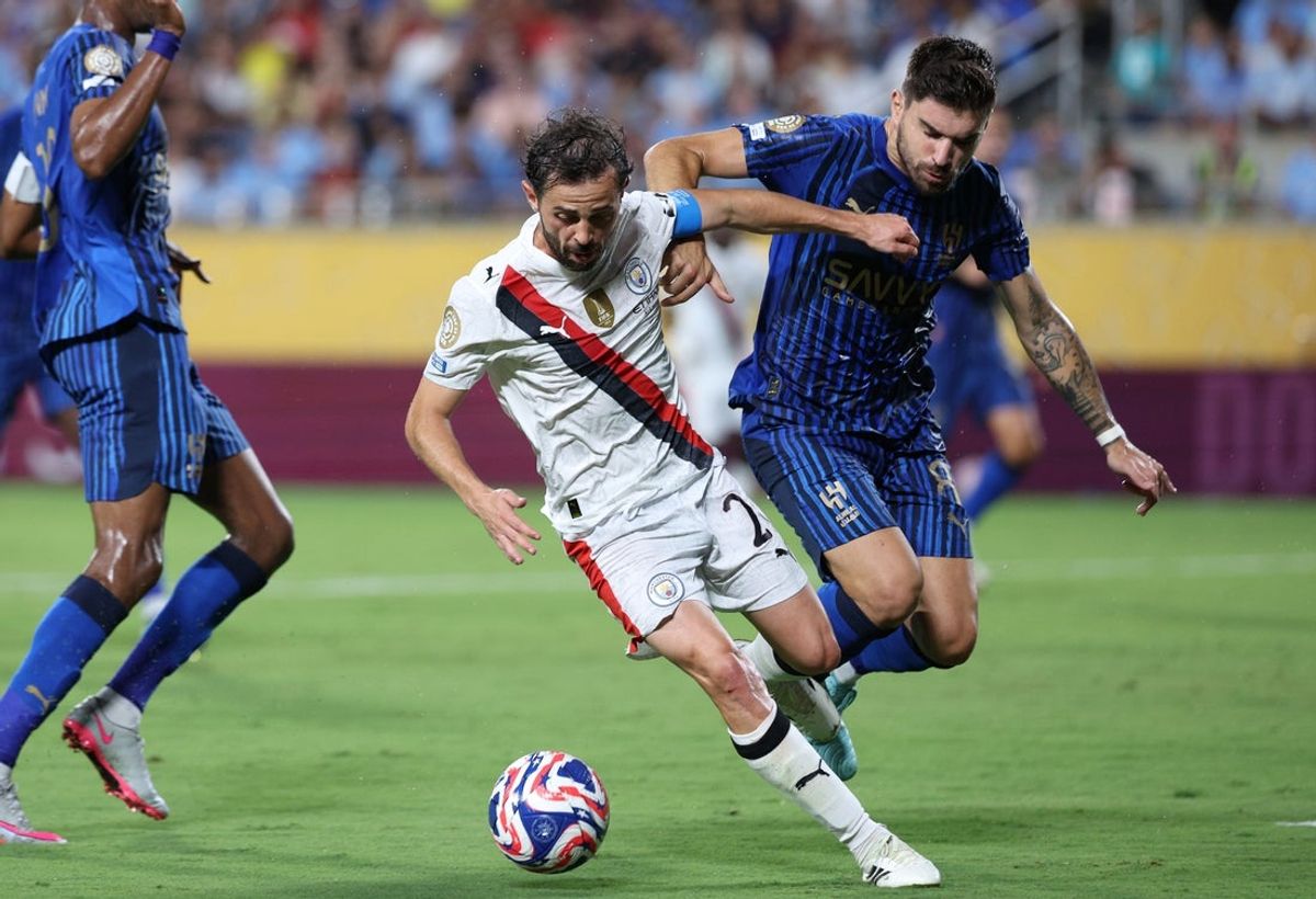 Jun 30, 2025; Orlando, Florida, USA; Manchester City midfielder Bernardo Silva (20) and Al Hilal FC midfielder Ruben Neves (8) battle for the ball in the first half during a round of 16 match of the 2025 FIFA Club World Cup at Camping World Stadium. Mandatory Credit: Nathan Ray Seebeck-Imagn Images