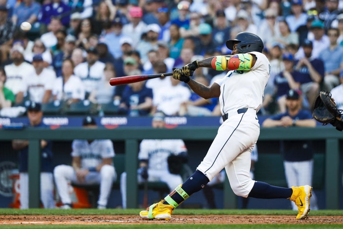 Jun 30, 2025; Seattle, Washington, USA; Seattle Mariners left fielder Randy Arozarena (56) hits a three-run home run against the Kansas City Royals during the fifth inning at T-Mobile Park. Mandatory Credit: Joe Nicholson-Imagn Images