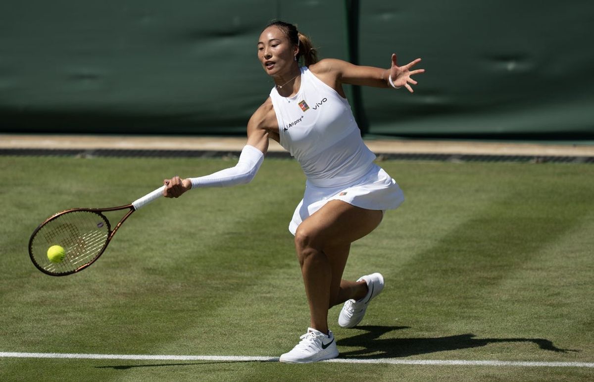 Jul 1, 2025; Wimbledon, UNITED KINGDOM; Qinwen Zheng of China in action against Katerina Siniakova of Czech Republic on day two at the All England Lawn Tennis and Croquet Club. Mandatory Credit: Susan Mullane-Imagn Images