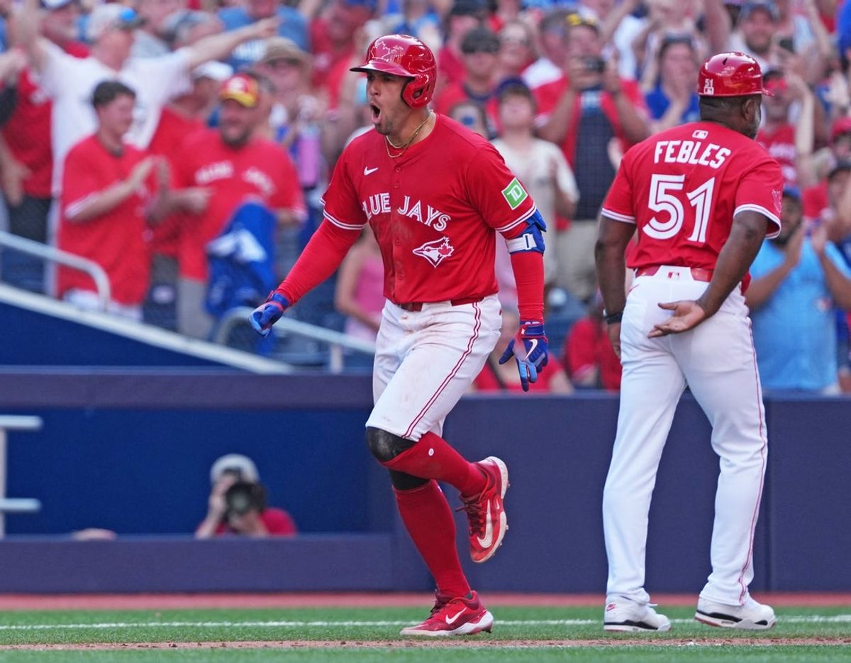 Jul 1, 2025; Toronto, Ontario, CAN;  Toronto Blue Jays right fielder George Springer (4) runs the bases after hitting a grand slam home run against the New York Yankees during the seventh inning at Rogers Centre. Mandatory Credit: Nick Turchiaro-Imagn Images