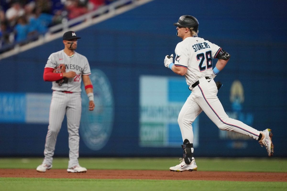 Jul 1, 2025; Miami, Florida, USA;  Miami Marlins left fielder Kyle Stowers (28) rounds the bases after hitting a home run in the second inning against the Minnesota Twins at loanDepot Park. Mandatory Credit: Jim Rassol-Imagn Images