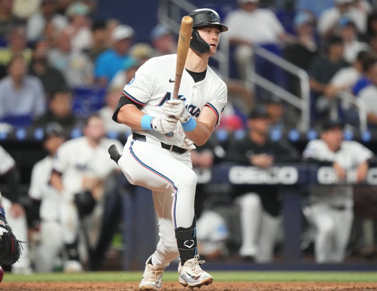 Jul 1, 2025; Miami, Florida, USA;  Miami Marlins left fielder Kyle Stowers (28) hits a single in the seventh inning at  loanDepot Park against the Minnesota Twins. Mandatory Credit: Jim Rassol-Imagn Images