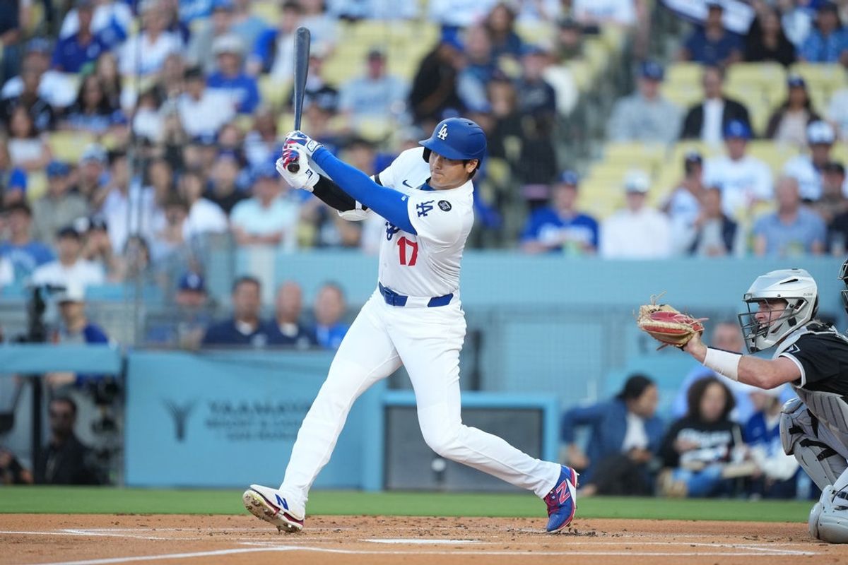 Jul 1, 2025; Los Angeles, California, USA; Los Angeles Dodgers designated hitter Shohei Ohtani (17) swings at a pitch during the first inning against the Chicago White Sox  at Dodger Stadium. Mandatory Credit: Kirby Lee-Imagn Images