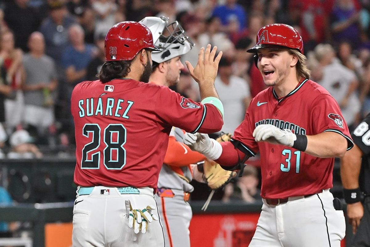 Jul 1, 2025; Phoenix, Arizona, USA; Arizona Diamondbacks outfielder Jake McCarthy (31) celebrates with third base Eugenio Suárez (28) after hitting a three run home run in the fourth inning against the San Francisco Giants  at Chase Field. Mandatory Credit: Matt Kartozian-Imagn Images