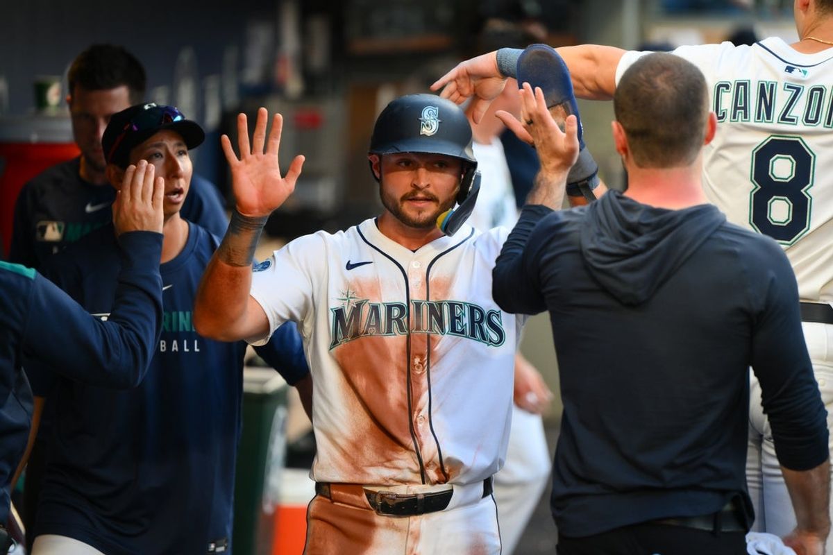 Jul 1, 2025; Seattle, Washington, USA; Seattle Mariners third baseman Ben Williamson (9) celebrates in the dugout after scoring a run against Kansas City Royals during the fifth inning at T-Mobile Park. Mandatory Credit: Steven Bisig-Imagn Images