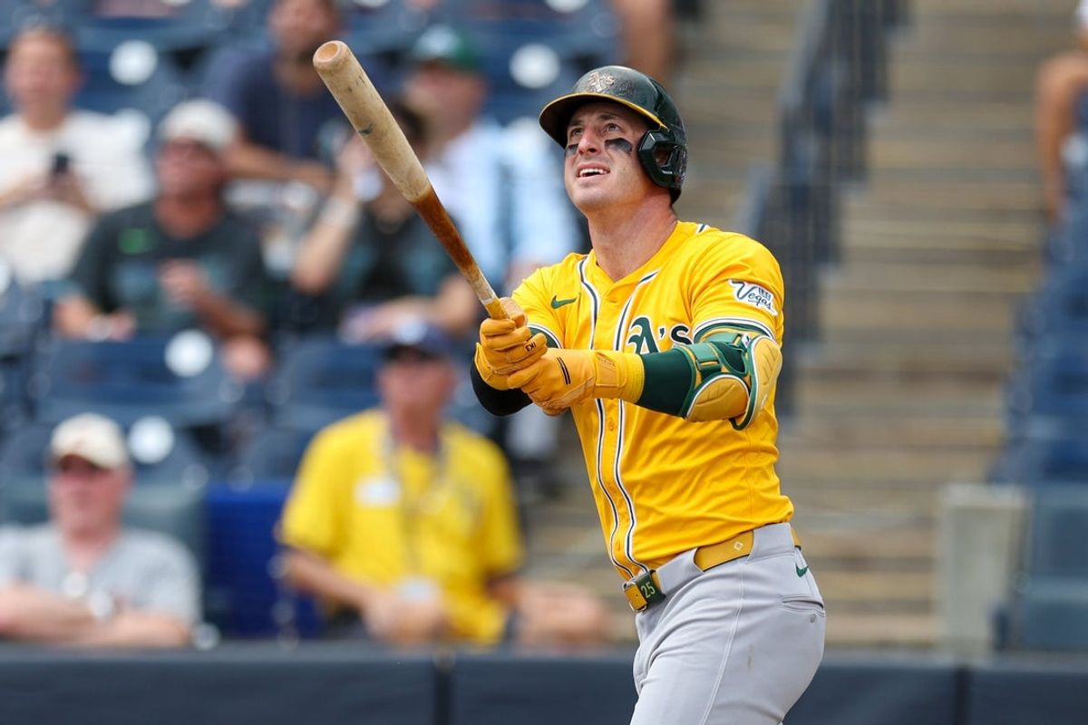 Jul 2, 2025; Tampa, Florida, USA; Athletics right fielder Brent Rooker (25) hits a home run against the Tampa Bay Rays in the first inning at George M. Steinbrenner Field. Mandatory Credit: Nathan Ray Seebeck-Imagn Images