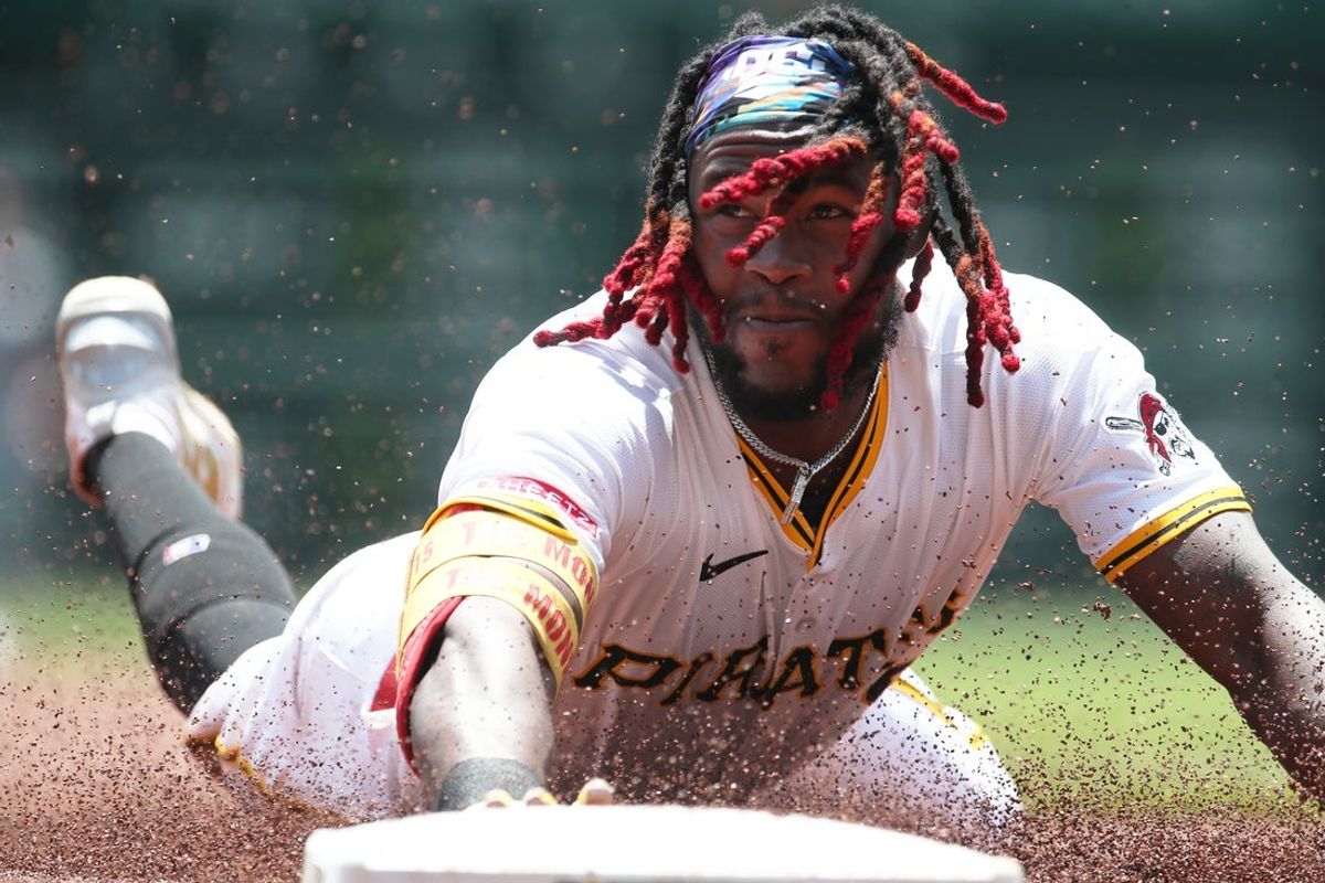 Jul 2, 2025; Pittsburgh, Pennsylvania, USA;  Pittsburgh Pirates center fielder Oneil Cruz (15) steals third base against he St. Louis Cardinals during the second inning at PNC Park. Mandatory Credit: Charles LeClaire-Imagn Images