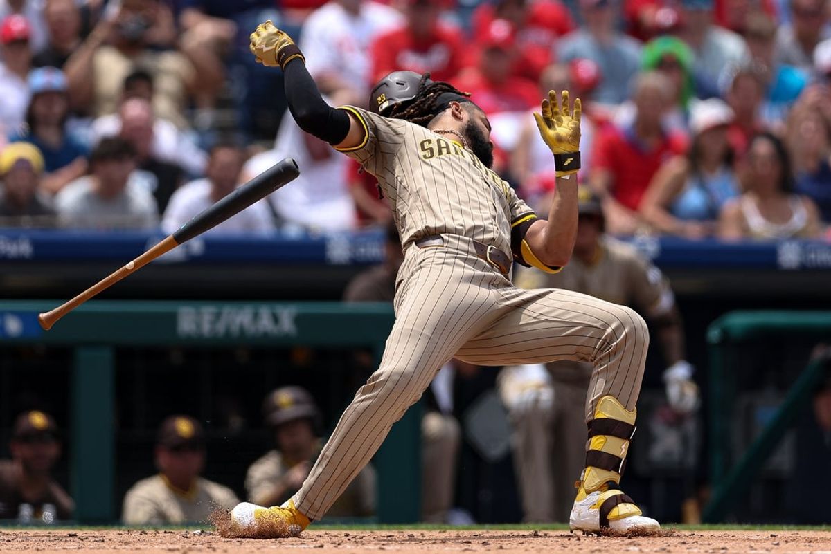 Jul 2, 2025; Philadelphia, Pennsylvania, USA; San Diego Padres outfielder Fernando Tatis Jr. (23) avoids an inside pitch during the second inning against the Philadelphia Phillies at Citizens Bank Park. Mandatory Credit: Bill Streicher-Imagn Images