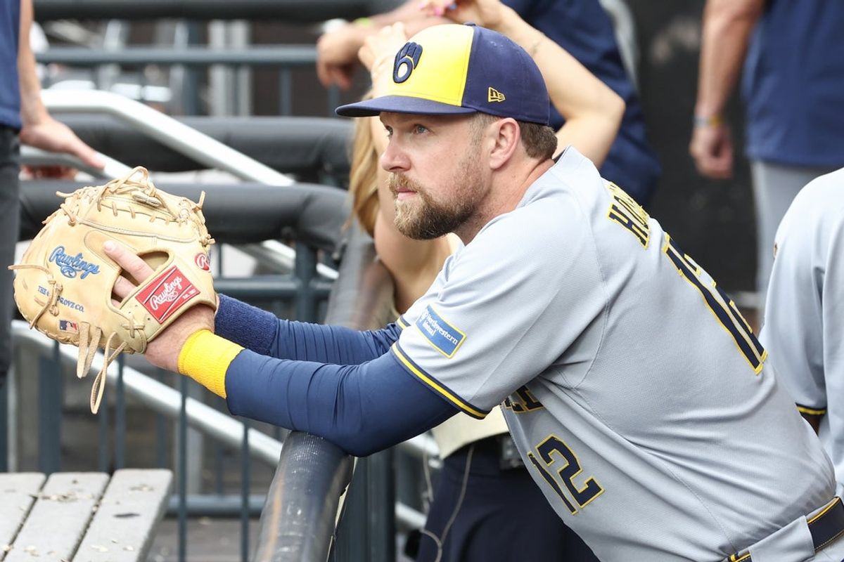 Jul 2, 2025; New York City, New York, USA;  Milwaukee Brewers first baseman Rhys Hoskins (12) watches from the dugout prior to game against the New York Mets at Citi Field. Mandatory Credit: Wendell Cruz-Imagn Images