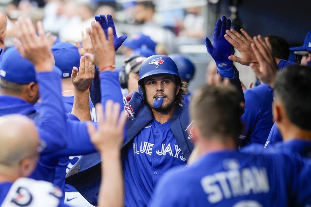 Jul 2, 2025; Toronto, Ontario, CAN; Toronto Blue Jays third base Addison Barger (47) celebrates hitting a home run against the New York Yankees during the first inning at Rogers Centre. Mandatory Credit: Kevin Sousa-Imagn Images