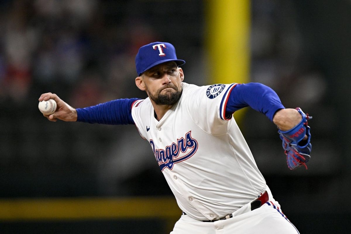 Jul 2, 2025; Arlington, Texas, USA; Texas Rangers starting pitcher Nathan Eovaldi (17) pitches against the Baltimore Orioles during the first inning at Globe Life Field. Mandatory Credit: Jerome Miron-Imagn Images