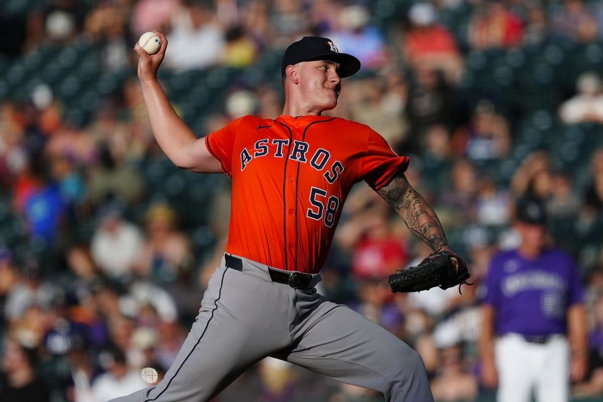Jul 2, 2025; Denver, Colorado, USA; Houston Astros starting pitcher Hunter Brown (58) delivers a pitch in the first inning against the Colorado Rockies at Coors Field. Mandatory Credit: Ron Chenoy-Imagn Images