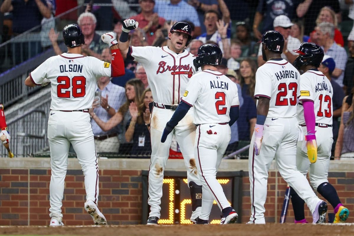 Jul 2, 2025; Atlanta, Georgia, USA; Atlanta Braves first baseman Matt Olson (28) celebrates with third baseman Austin Riley (27)after a grand slam against the Los Angeles Angels in the sixth inning at Truist Park. Mandatory Credit: Brett Davis-Imagn Images