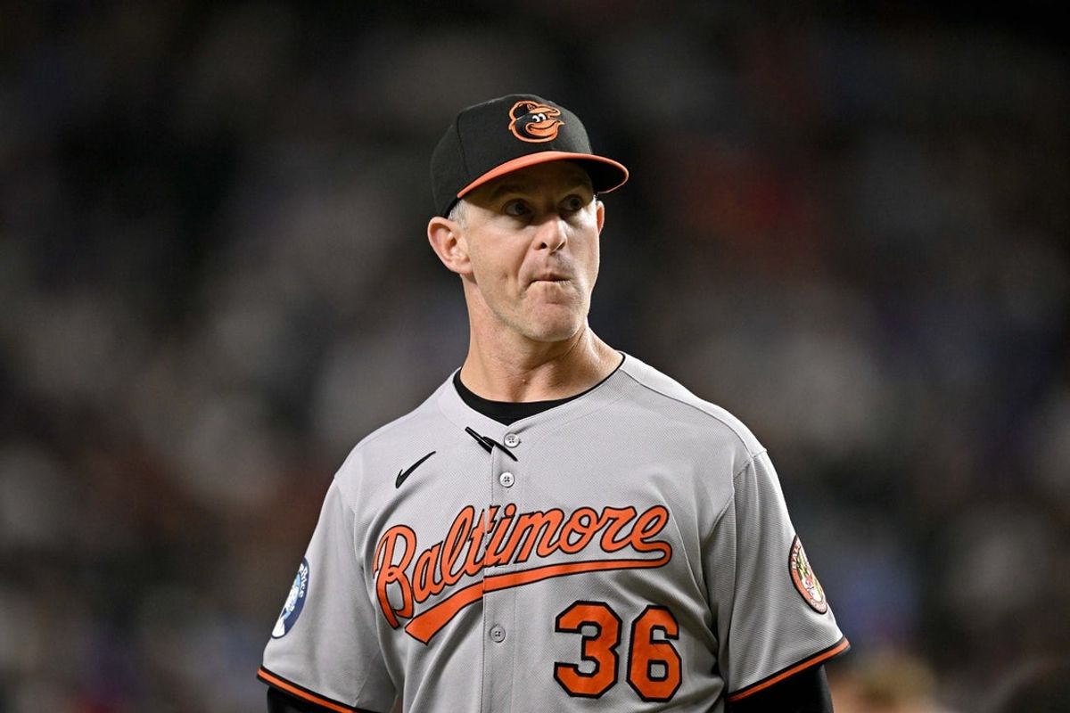 Jul 2, 2025; Arlington, Texas, USA; Baltimore Orioles interim manager Tony Mansolino (36) walks back to the dugout during the fifth inning against the Texas Rangers at Globe Life Field. Mandatory Credit: Jerome Miron-Imagn Images