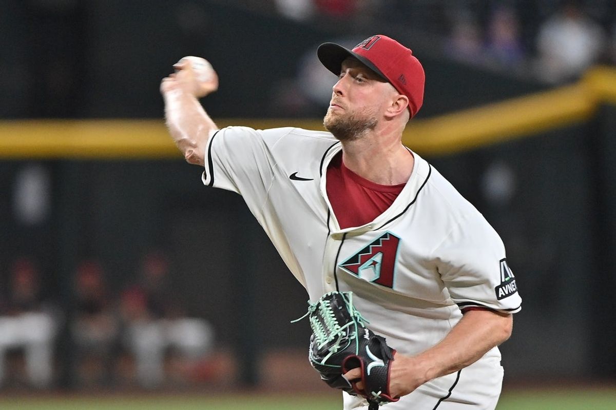 Jul 2, 2025; Phoenix, Arizona, USA;  Arizona Diamondbacks pitcher Zac Gallen (23) throws in the first inning against the San Francisco Giants at Chase Field. Mandatory Credit: Matt Kartozian-Imagn Images