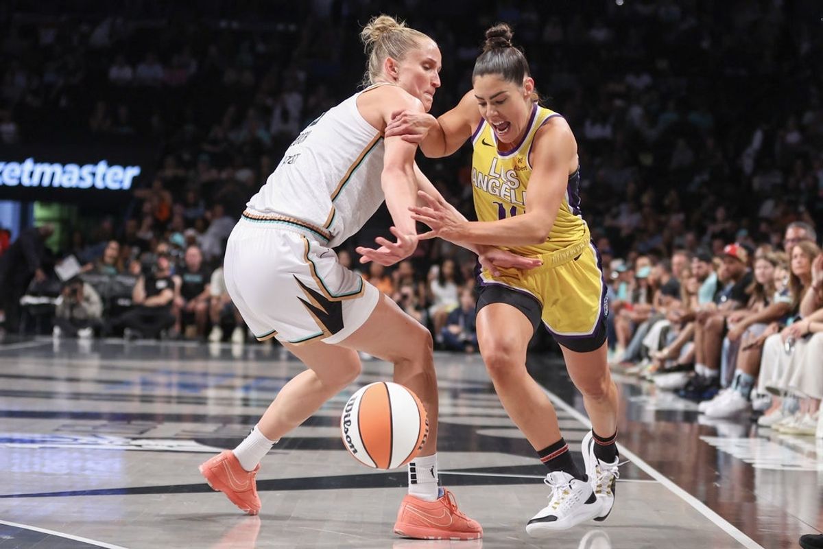 Jul 3, 2025; Brooklyn, New York, USA;  Los Angeles Sparks guard Kelsey Plum (10) and New York Liberty forward Leonie Fiebich (13) fight for a loose ball in the first quarter at Barclays Center. Mandatory Credit: Wendell Cruz-Imagn Images