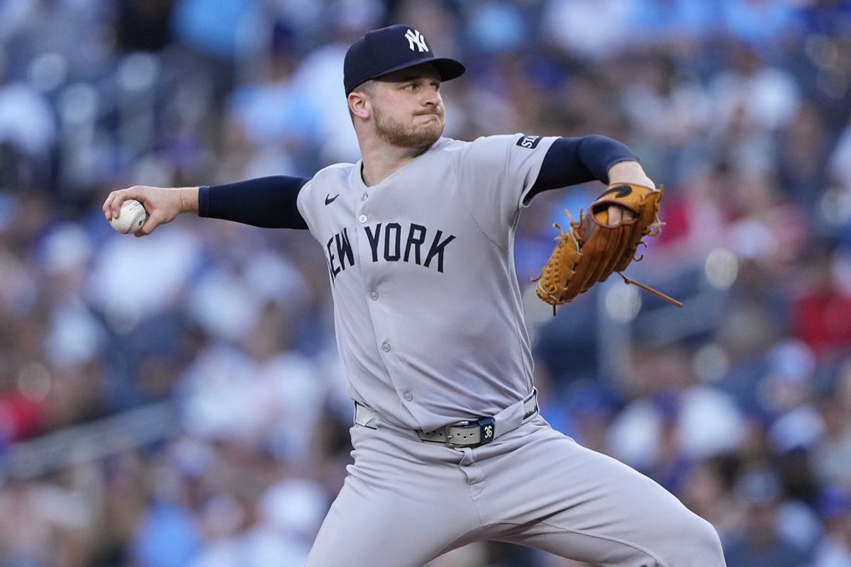 Jul 3, 2025; Toronto, Ontario, CAN; New York Yankees starting pitcher Clarke Schmidt (36) pitches to the Toronto Blue Jays during the second inning at Rogers Centre. Mandatory Credit: John E. Sokolowski-Imagn Images