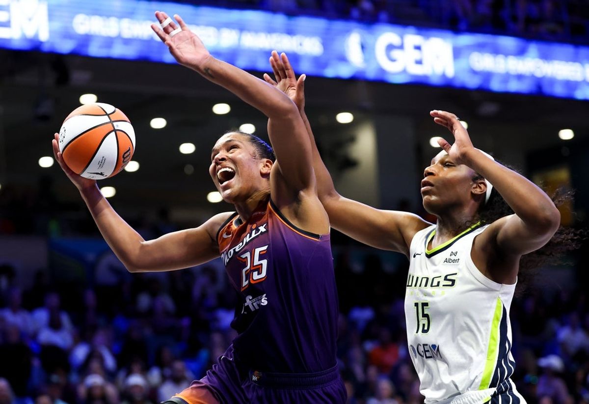 Jul 3, 2025; Arlington, Texas, USA;  Phoenix Mercury forward Alyssa Thomas (25) drives to the basket past Dallas Wings center Teaira McCowan (15) during the second half at College Park Center. Mandatory Credit: Kevin Jairaj-Imagn Images