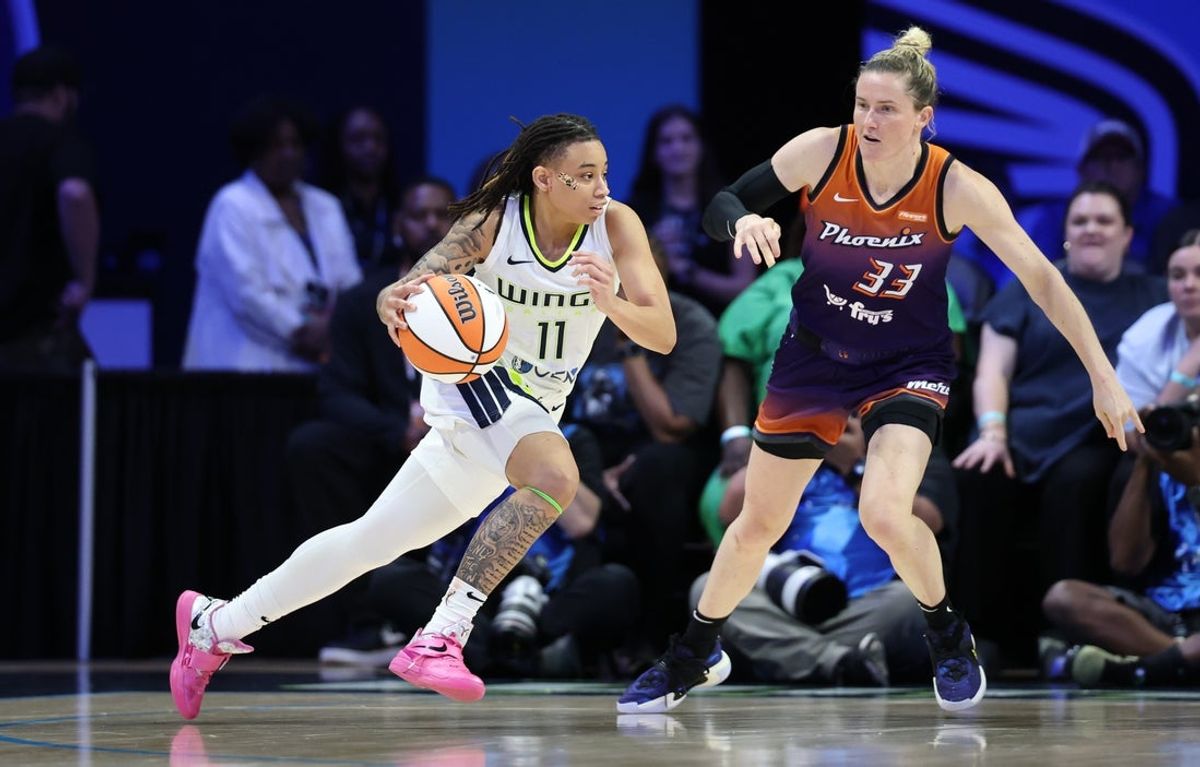 Jul 3, 2025; Arlington, Texas, USA;  Dallas Wings guard JJ Quinerly (11) drives to the basket as Phoenix Mercury guard Sami Whitcomb (33) defends during the second half at College Park Center. Mandatory Credit: Kevin Jairaj-Imagn Images