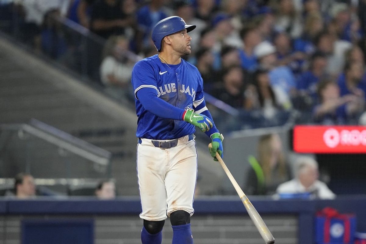 Jul 3, 2025; Toronto, Ontario, CAN; Toronto Blue Jays designated hitter George Springer (4) watches his hit ball go over the left field wall for a two run home run against the New York Yankees during the eighth inning at Rogers Centre. Mandatory Credit: John E. Sokolowski-Imagn Images