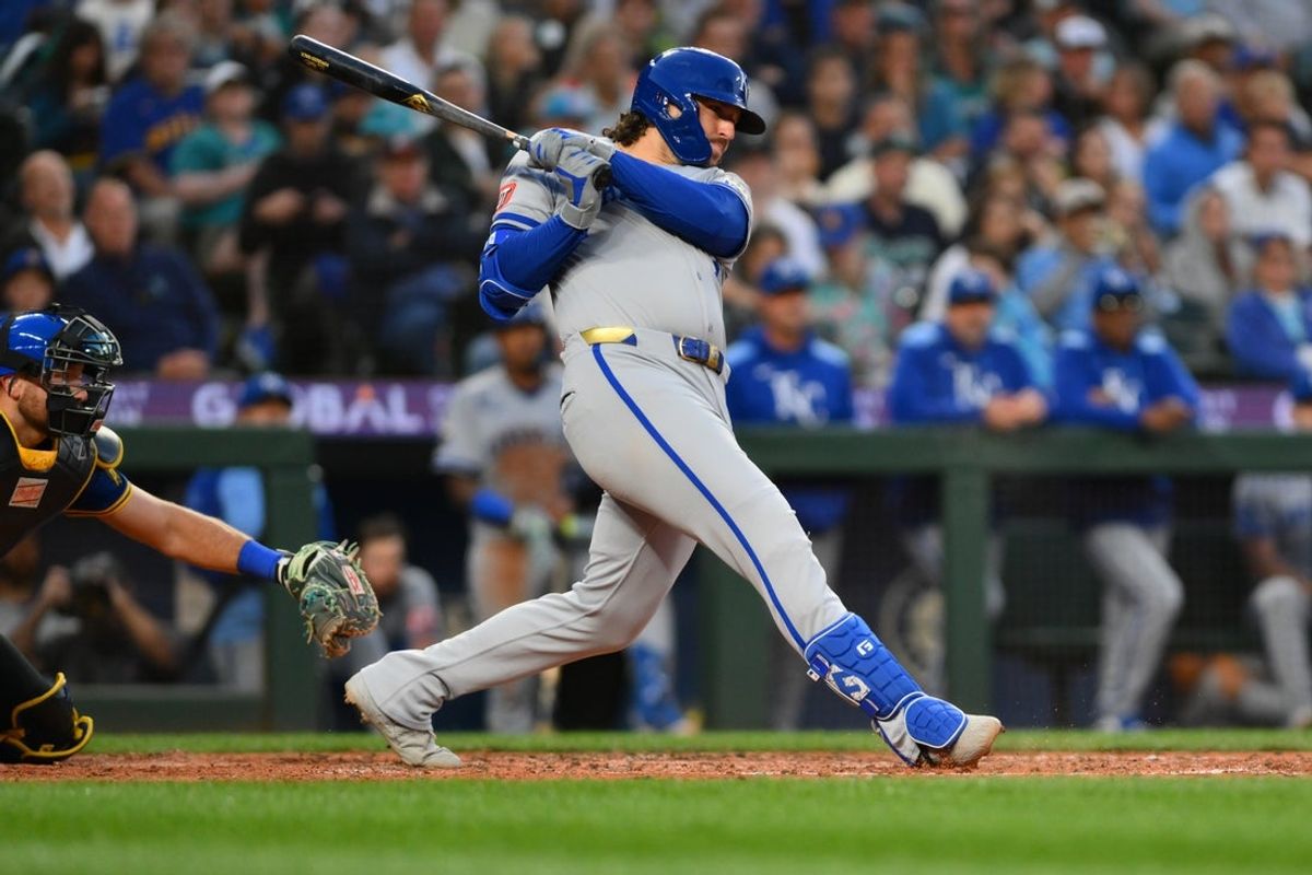 Jul 3, 2025; Seattle, Washington, USA; Kansas City Royals first baseman Vinnie Pasquantino (9) hits a 2-RBI single against the Seattle Mariners during the seventh inning at T-Mobile Park. Mandatory Credit: Steven Bisig-Imagn Images
