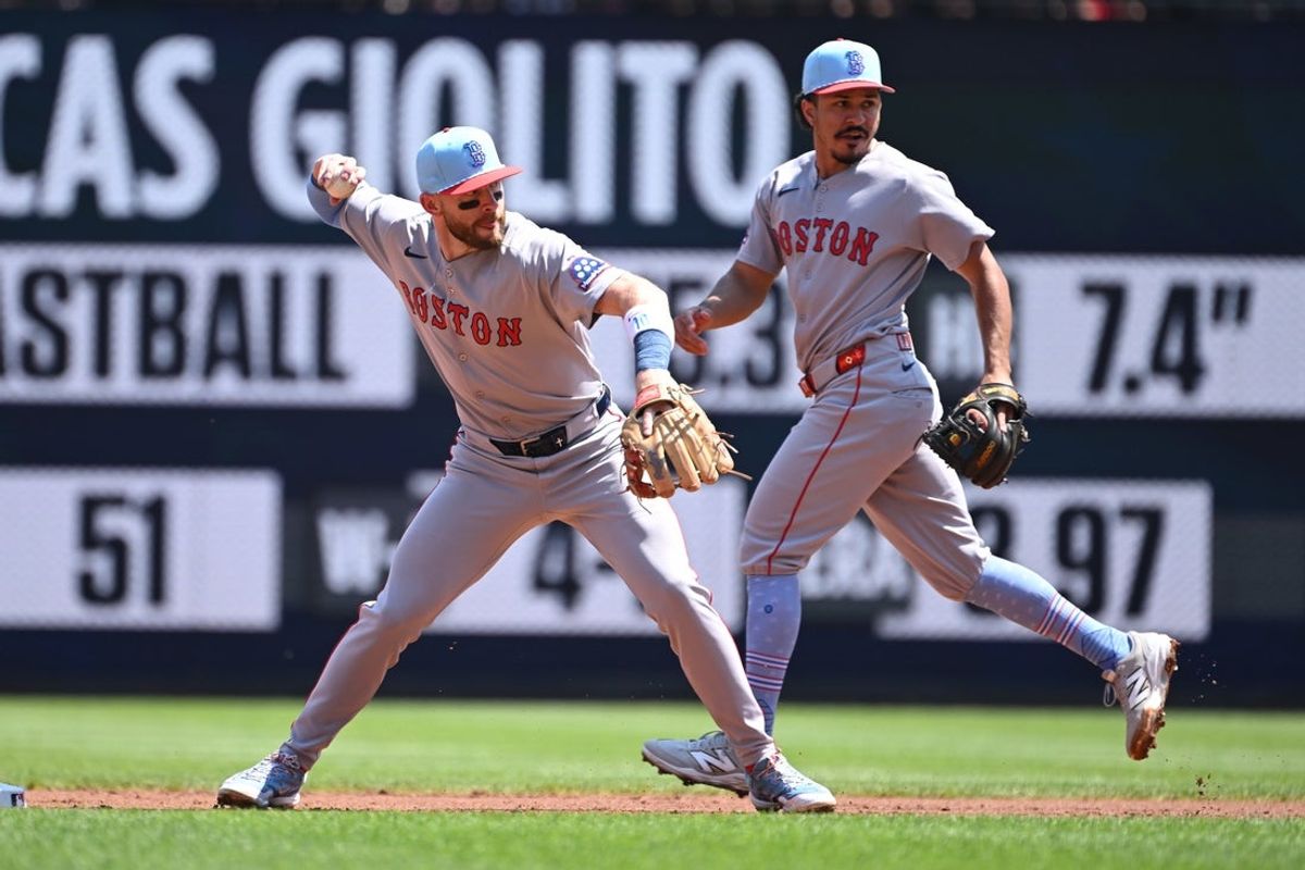 Jul 4, 2025; Washington, District of Columbia, USA; Boston Red Sox shortstop Trevor Story (10) throws to first base against the Washington Nationals during the first inning at Nationals Park. Mandatory Credit: Rafael Suanes-Imagn Images