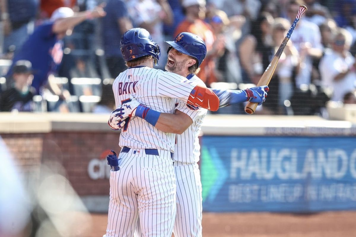 Jul 4, 2025; New York City, New York, USA;  New York Mets second baseman Jeff McNeil (1) celebrates with third baseman Brett Baty (7) after hitting a two run home run in the seventh inning against the New York Yankees at Citi Field. Mandatory Credit: Wendell Cruz-Imagn Images