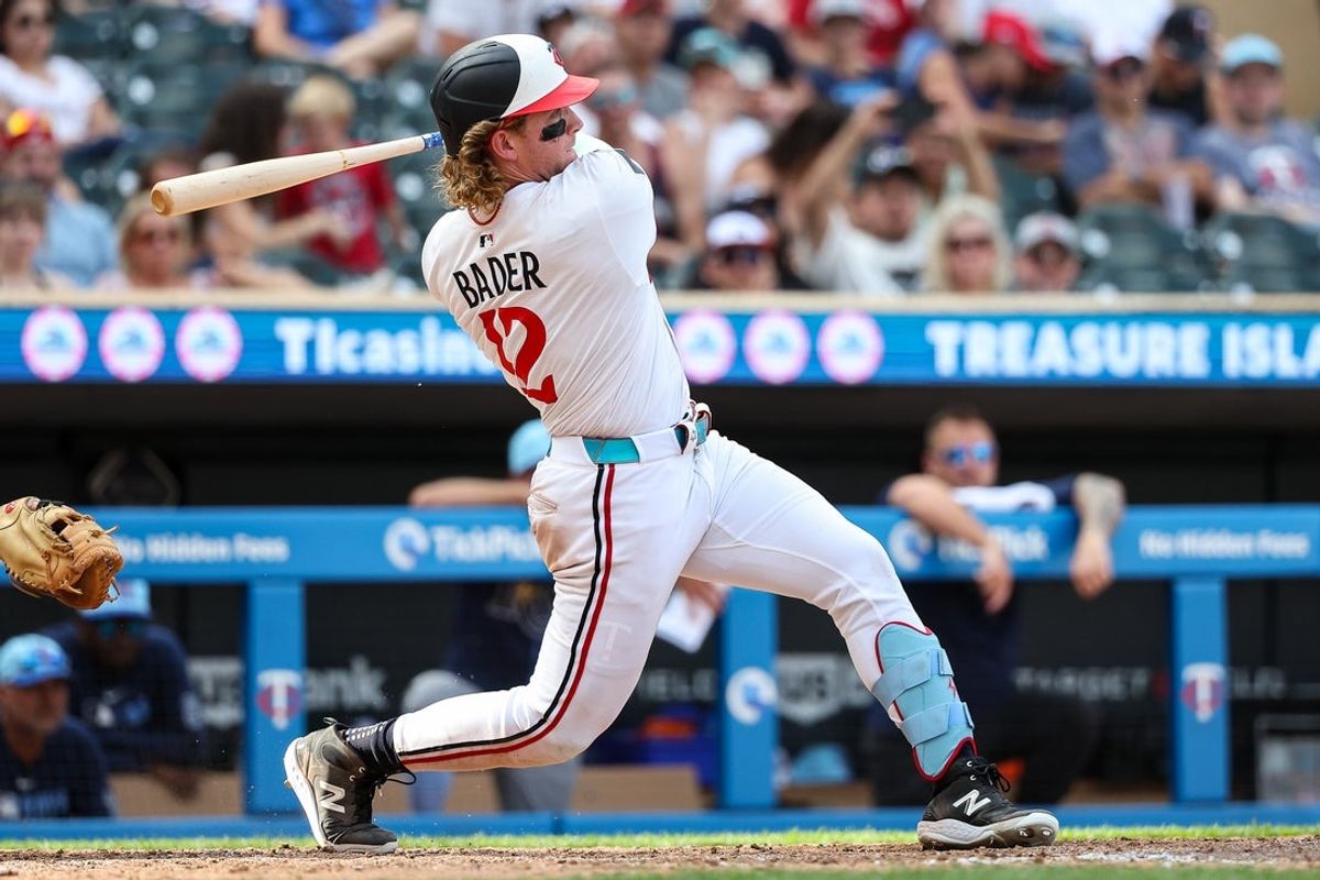 Jul 4, 2025; Minneapolis, Minnesota, USA; Minnesota Twins left fielder Harrison Bader (12) hits a solo walk-off home run against the Tampa Bay Rays during the ninth inning at Target Field. Mandatory Credit: Matt Krohn-Imagn Images