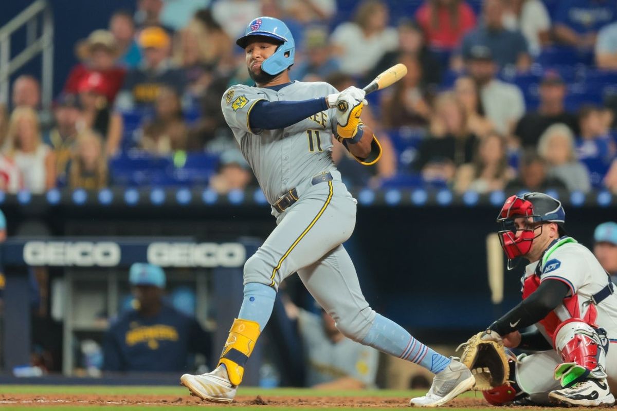 Jul 4, 2025; Miami, Florida, USA; Milwaukee Brewers center fielder Jackson Chourio (11) hits an RBI double against the Miami Marlins during the eighth inning at loanDepot Park. Mandatory Credit: Sam Navarro-Imagn Images