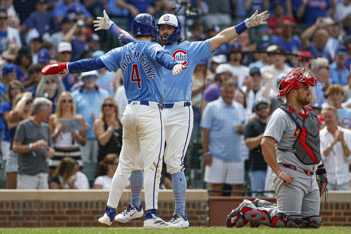 Jul 4, 2025; Chicago, Illinois, USA; Chicago Cubs shortstop Dansby Swanson (7) celebrates with center fielder Pete Crow-Armstrong (4) after hitting a two-run home run against the St. Louis Cardinals during the seventh inning at Wrigley Field. Mandatory Credit: Kamil Krzaczynski-Imagn Images