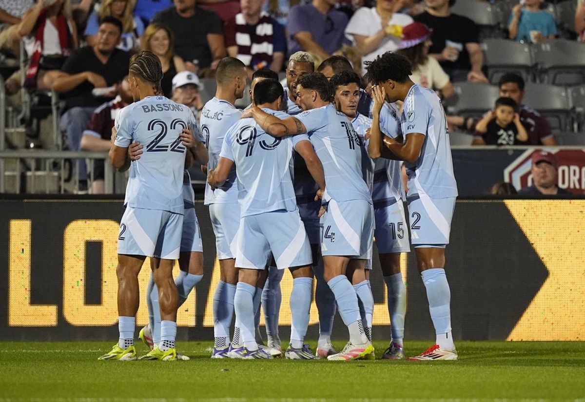 Jul 4, 2025; Commerce City, Colorado, USA; Members of the Sporting Kansas City celebrate a goal scored against the Colorado Rapids in the second half at Dick's Sporting Goods Park. Mandatory Credit: Ron Chenoy-Imagn Images