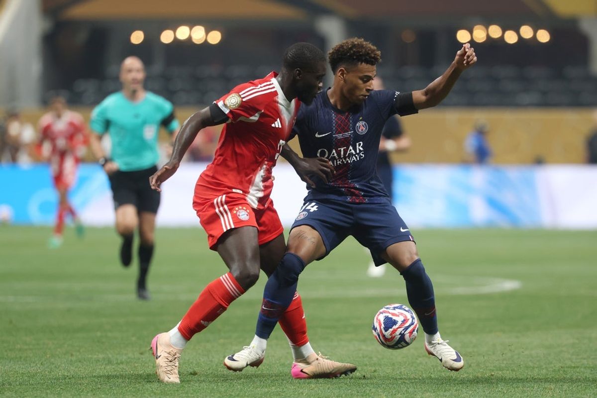 Jul 5, 2025; Atlanta, Georgia, USA; FC Bayern Munich defender Dayot Upamecano (2) and Paris Saint-Germain forward Desire Doue (14) battle for the ball in the first half during a quarterfinal match of the 2025 FIFA Club World Cup at Mercedes-Benz Stadium. Mandatory Credit: Brett Davis-Imagn Images