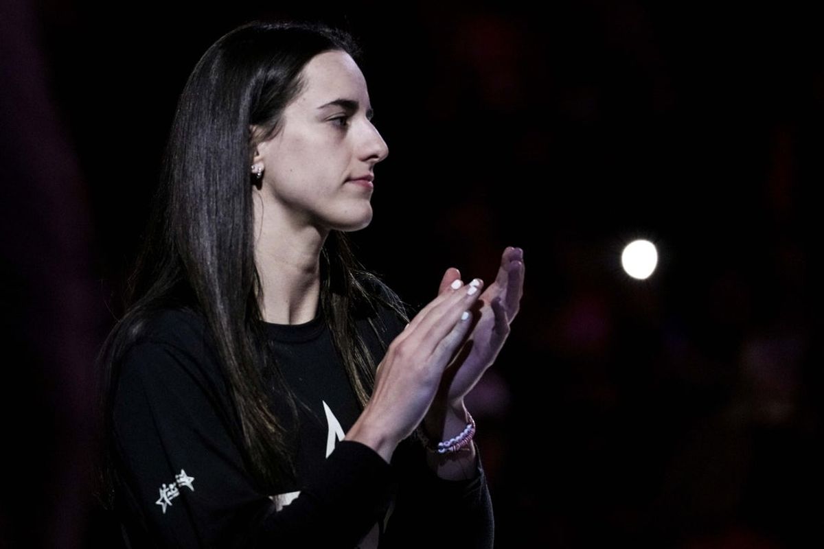 July 3, 2025; Indianapolis, Indiana, USA; Indiana Fever guard Caitlin Clark (22) claps during team introductions at a game against the Las Vegas Aces at Gainbridge Fieldhouse. Mandatory Credit: Grace Smith/INDIANAPOLIS STAR-Imagn Images