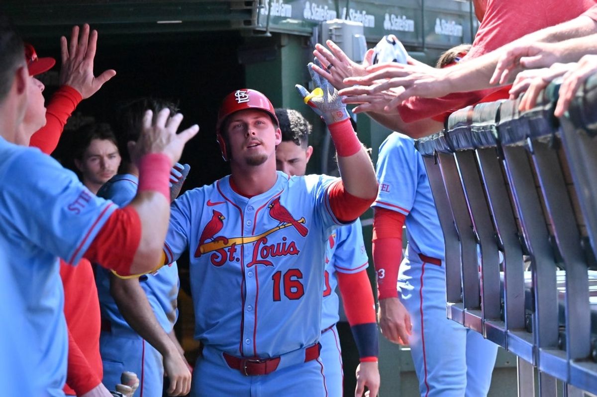 Jul 5, 2025; Chicago, Illinois, USA; St. Louis Cardinals designated hitter Nolan Gorman (16) celebrates his home run with teammates in the dugout during the fourth inning against the Chicago Cubs at Wrigley Field. Mandatory Credit: Patrick Gorski-Imagn Images