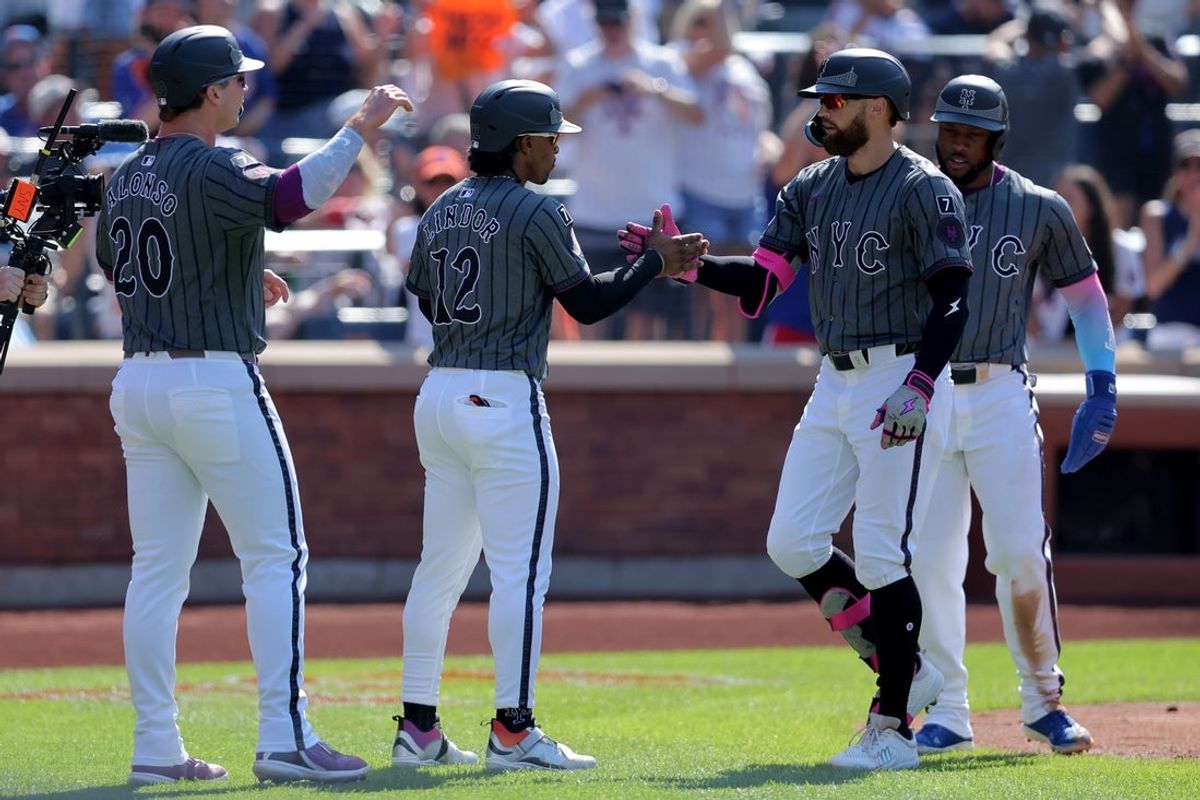 Jul 5, 2025; New York City, New York, USA; New York Mets left fielder Brandon Nimmo (9) celebrates his grand slam against the New York Yankees with first baseman Pete Alonso (20) and shortstop Francisco Lindor (12) and designated hitter Starling Marte (6) during the first inning at Citi Field. Mandatory Credit: Brad Penner-Imagn Images