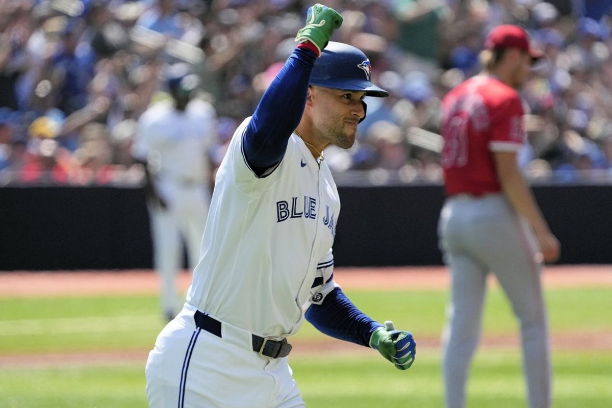 Jul 5, 2025; Toronto, Ontario, CAN; Toronto Blue Jays left fielder George Springer (4) reacts as he runs to first base on his two run home run against the Los Angeles Angels during the third inning at Rogers Centre. Mandatory Credit: John E. Sokolowski-Imagn Images